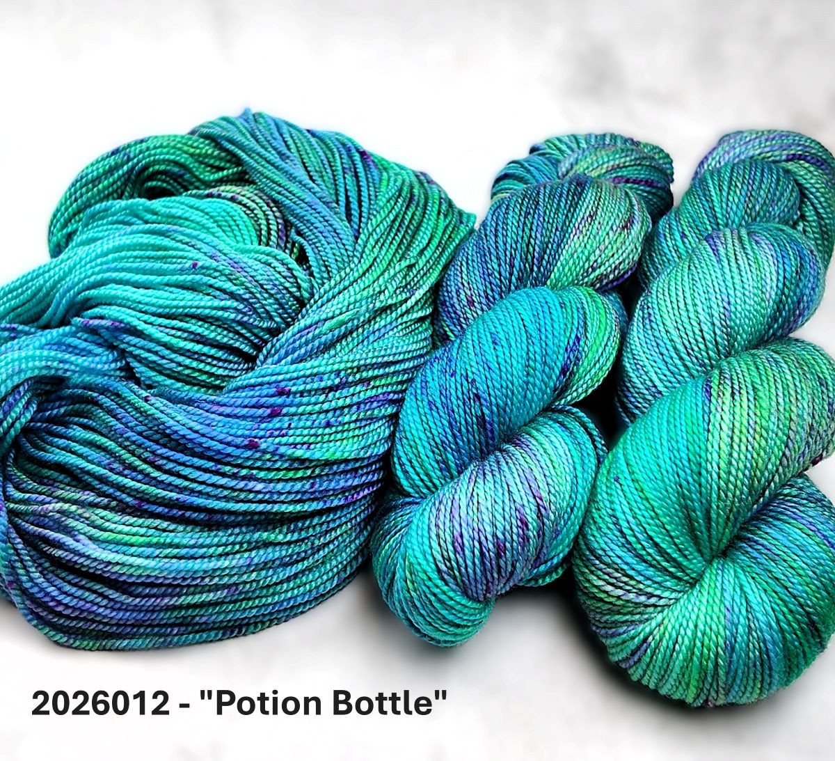 2026012 - 8 Ply Hand Dyed Super Wash Merino Yarn - "Potion Bottle"